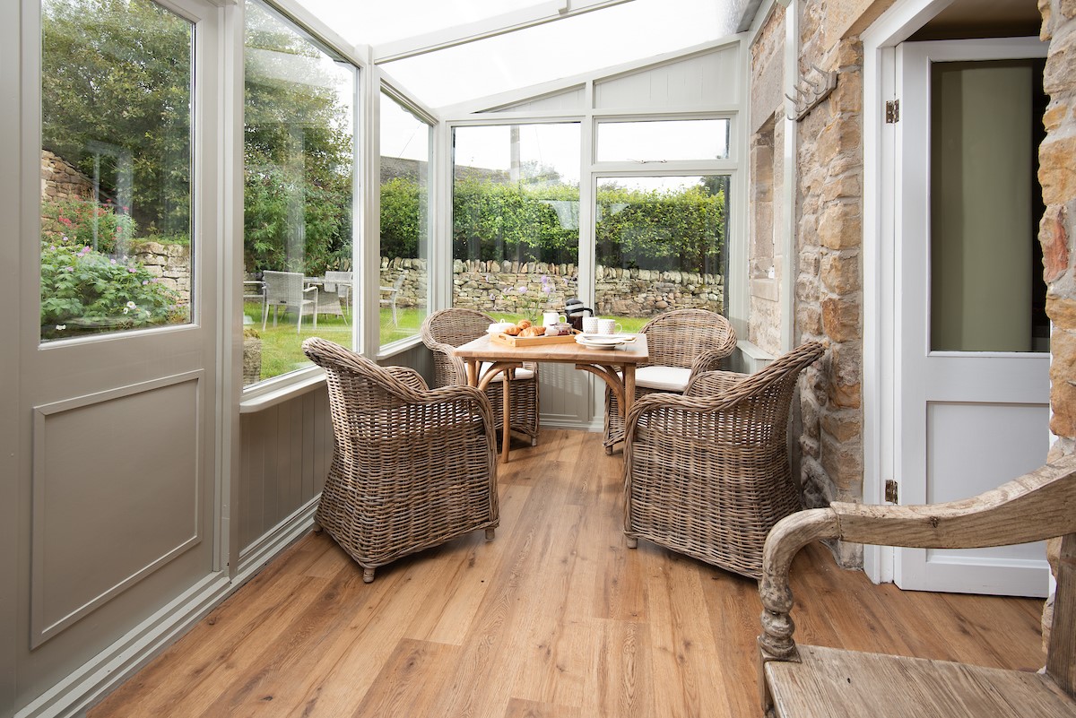 Aydon Castle Cottage - the summer room with views into the garden