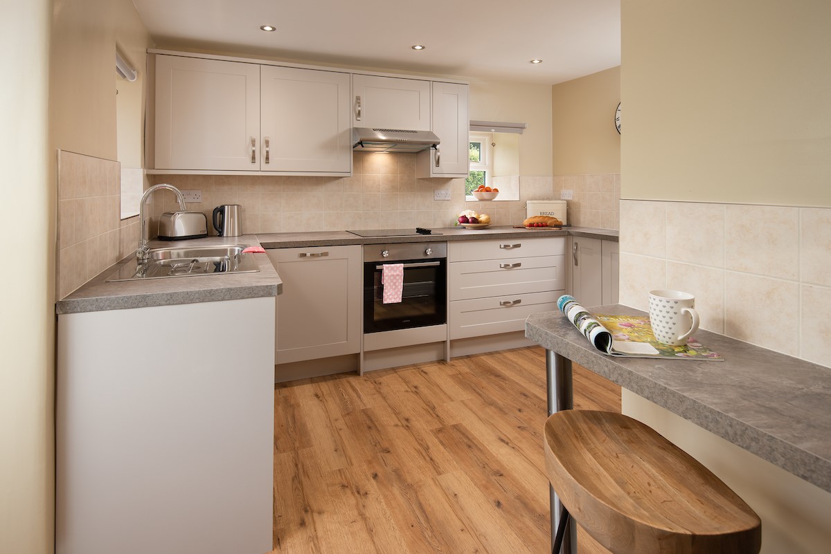 Aydon Castle Cottage - the kitchen with breakfast bar