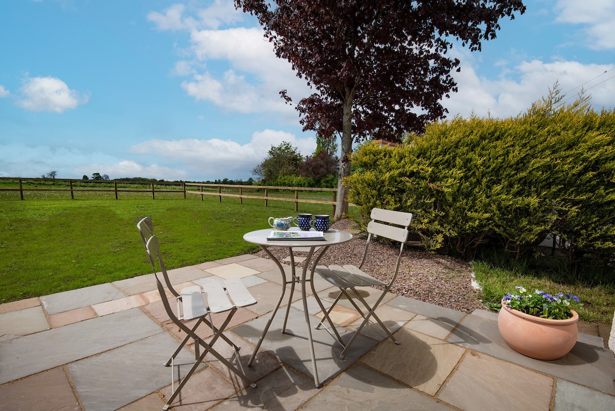 Westwood Cottage - enjoy your morning coffee on the sunny terrace with views of parkland to the rear