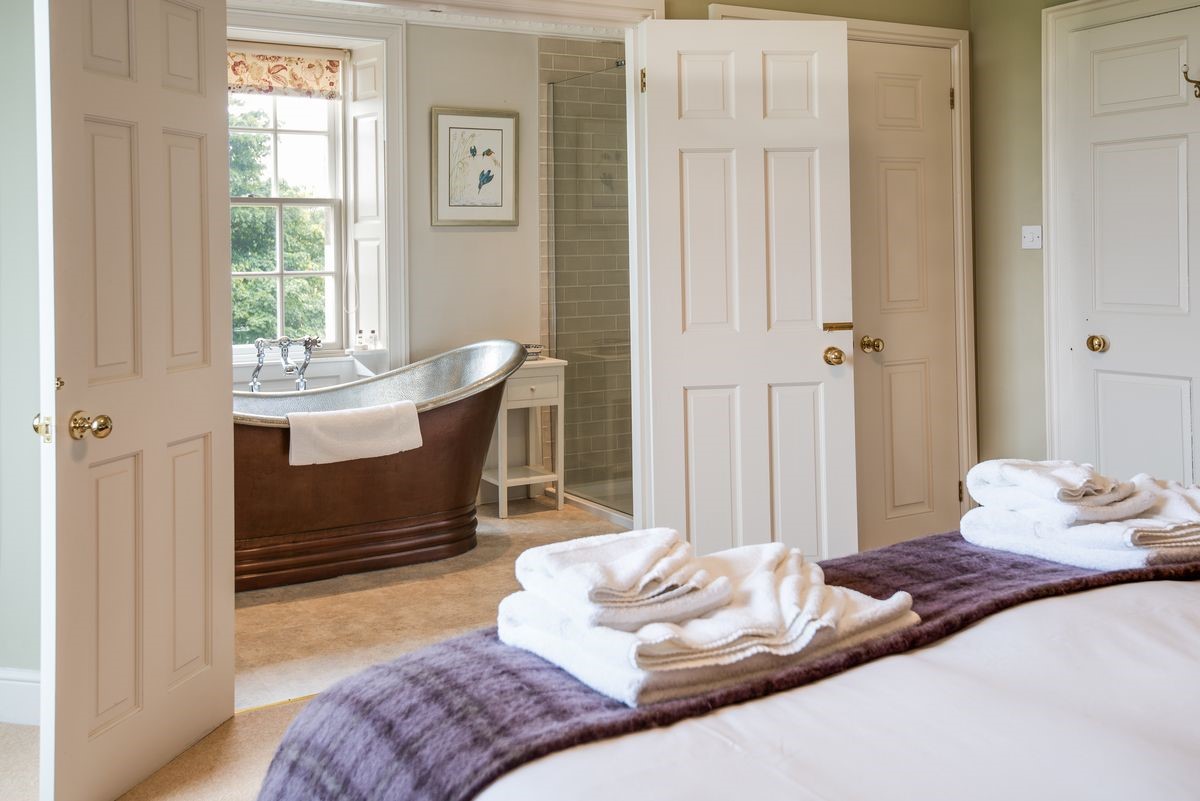 Abbey House - bedroom one has double doors taking you into the en suite bathroom
