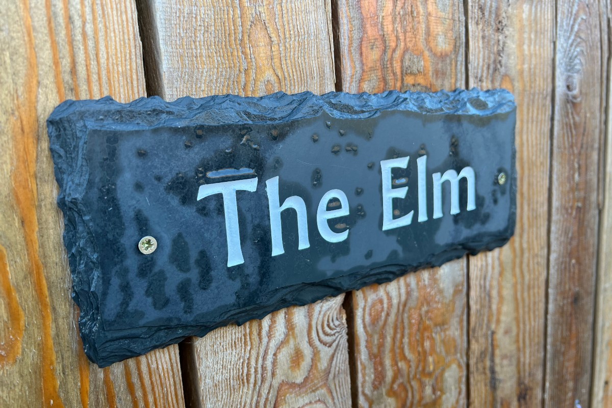 The Elm - slate welcome sign