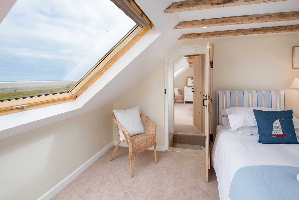 Beachcomber Cottage - bedroom two with twin beds and sea views