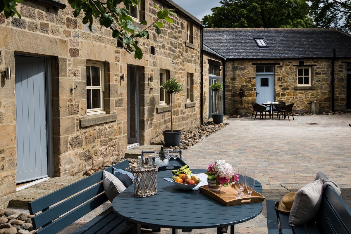 Coach House - outside courtyard with garden furniture
