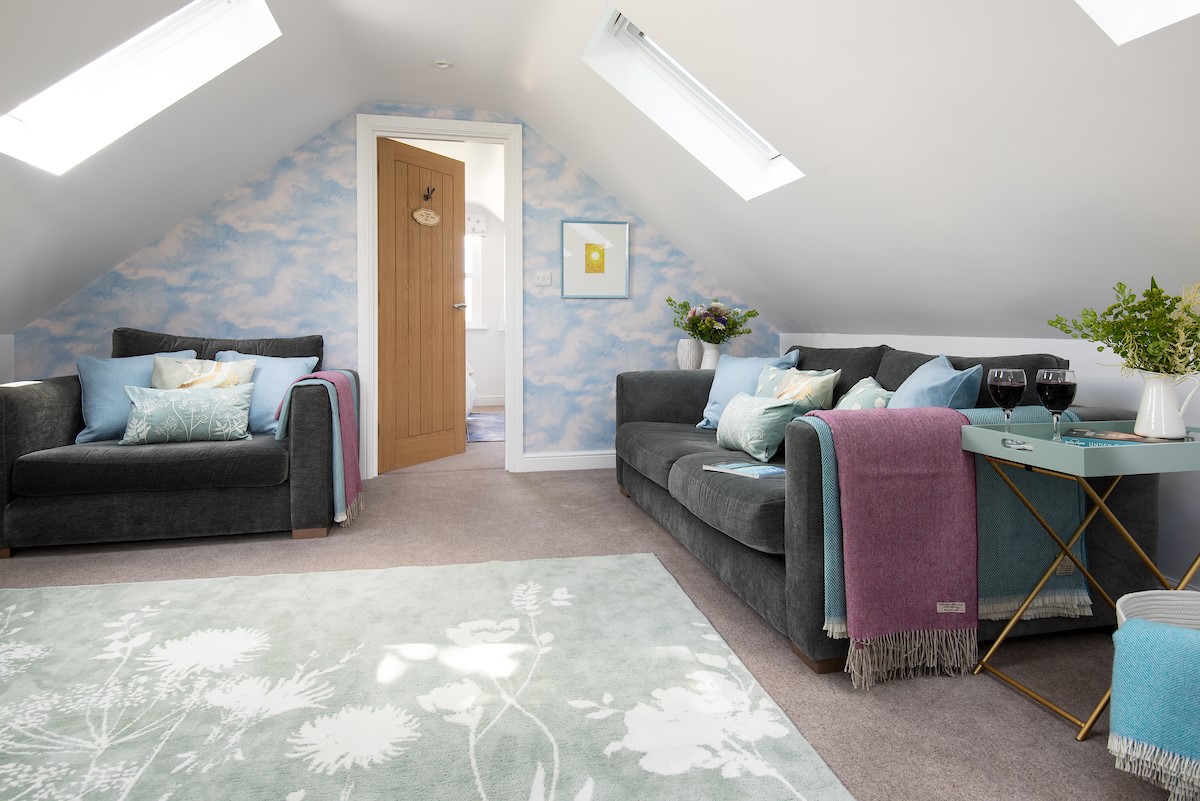 The Star Barn - large comfy sofa and love seat for guest to relax and unwind after a busy day exploring