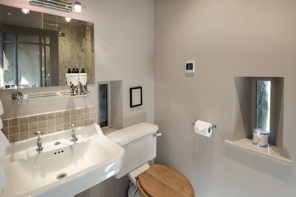 Williamston Barn & Cowshed - bedroom six en suite bathroom WC & basin