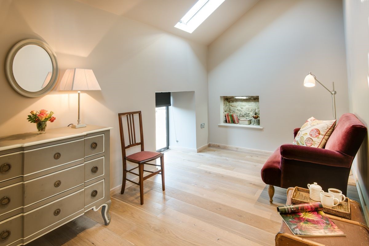 Williamston Barn & Cowshed - seating area in bedroom seven