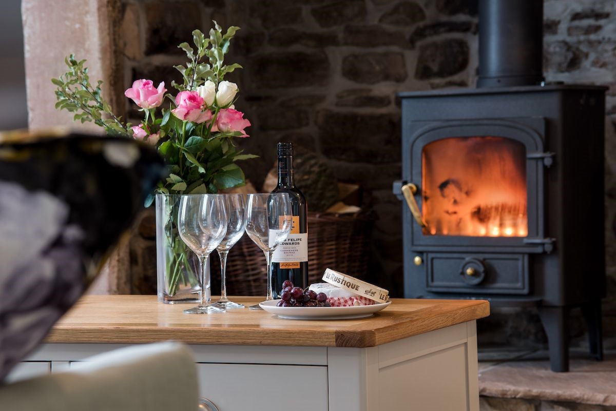 Curlew Cottage - enjoy cheese and wine by the wood burning stove