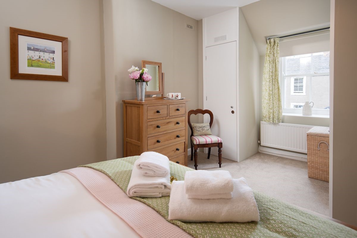 Crosslea - bedroom two on the first floor with king size bed and dressing table