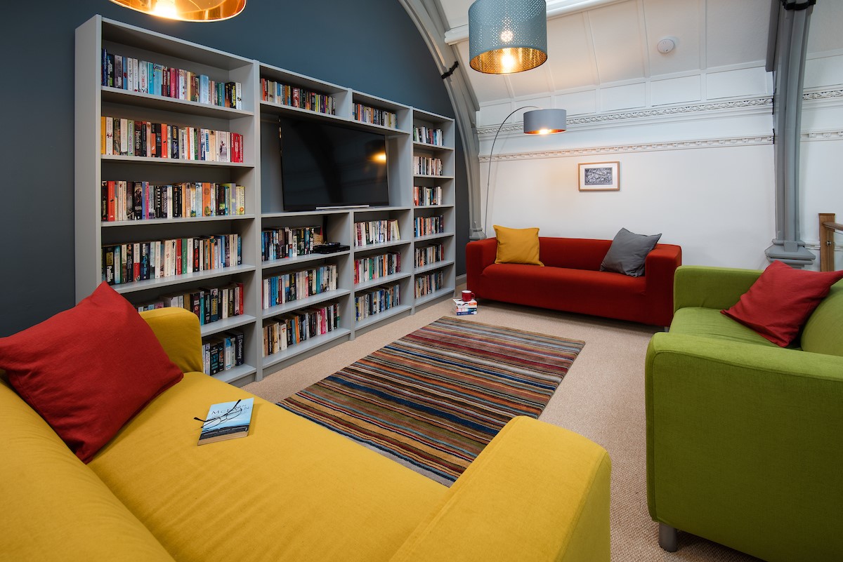 The Five Turrets - mezzanine with library and Smart TV