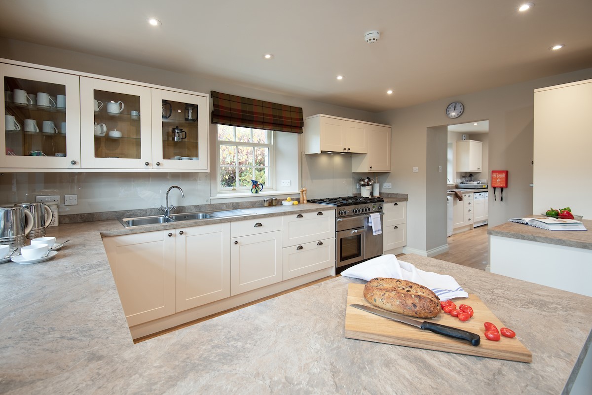 Countess Park - spacious kitchen leading into a large utility room