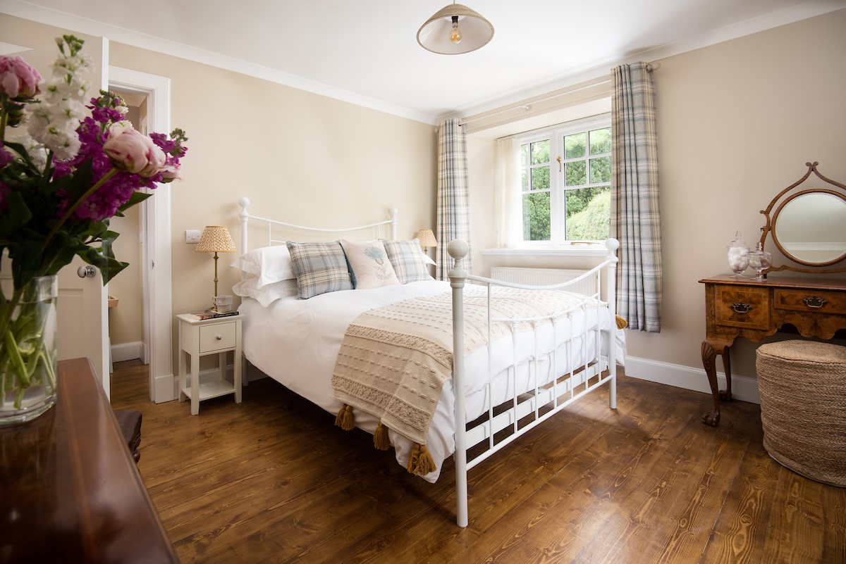 East Lodge at Ashiestiel - the principal bedroom with crisp linens and soft throws