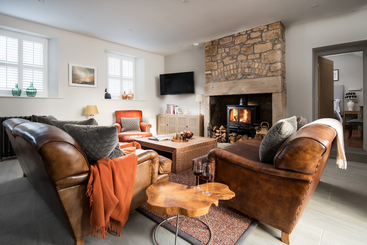 The Gallery - warm and cosy sitting room with ample seating, Smart TV and wood burner