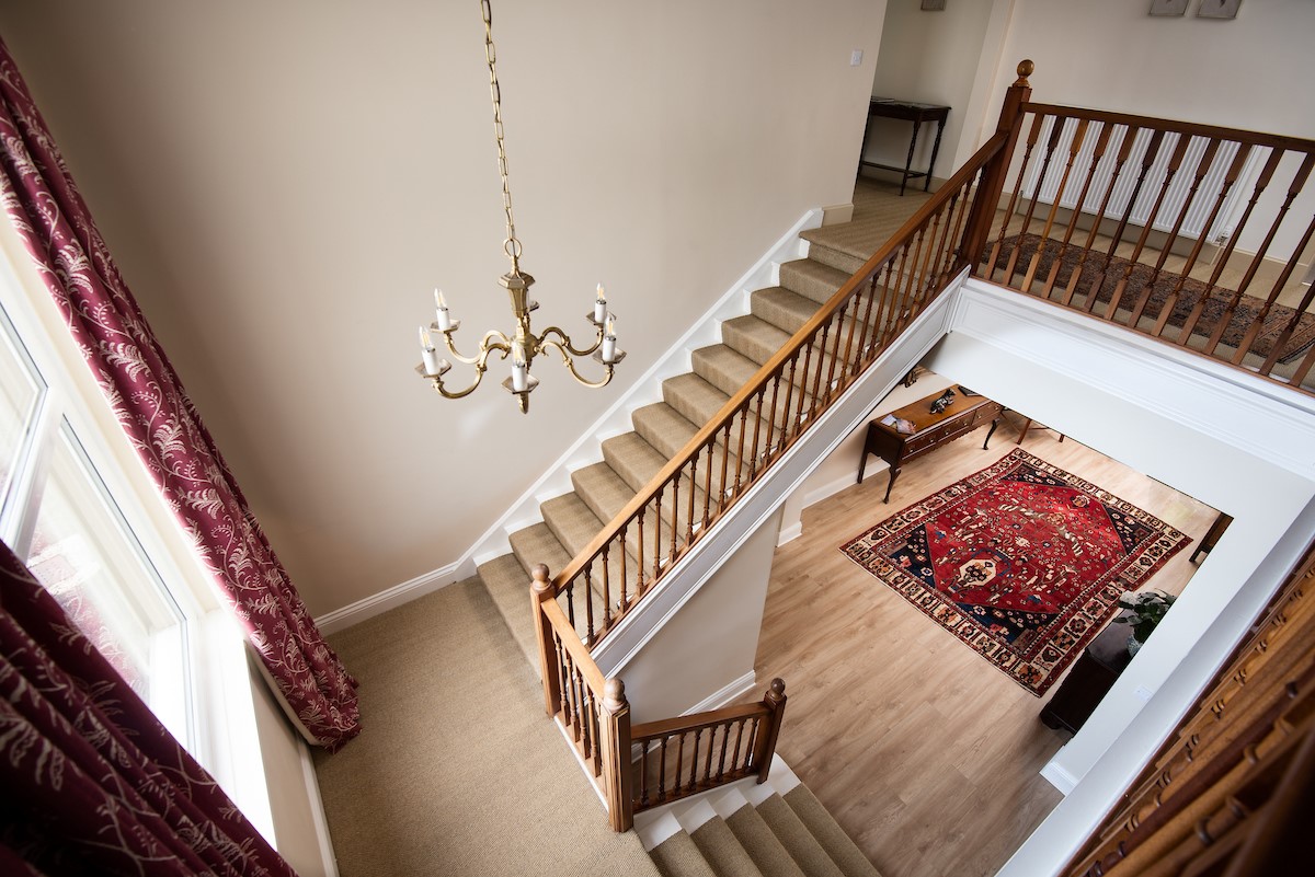 Wark Farmhouse - the staircase leading from the central hallway on the ground floor