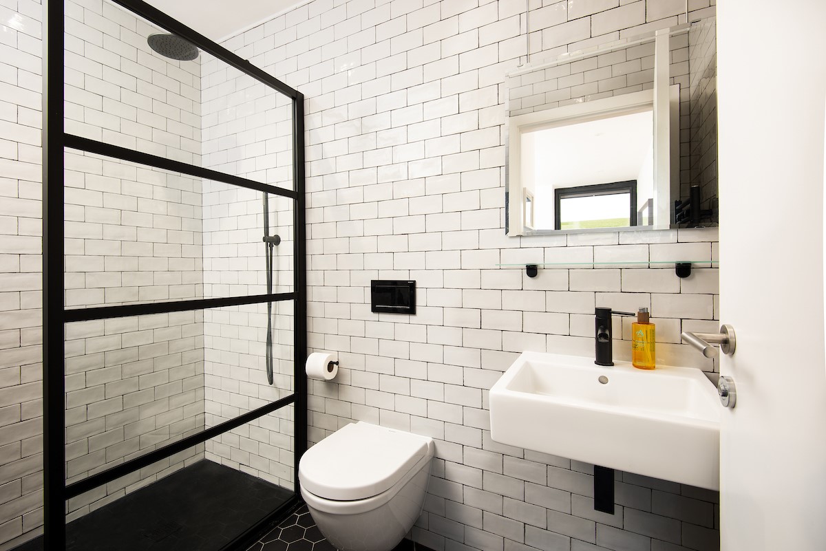 6 The Bay, Coldingham - the en suite shower room has a large walk-in shower with a Crittall-style glass screen