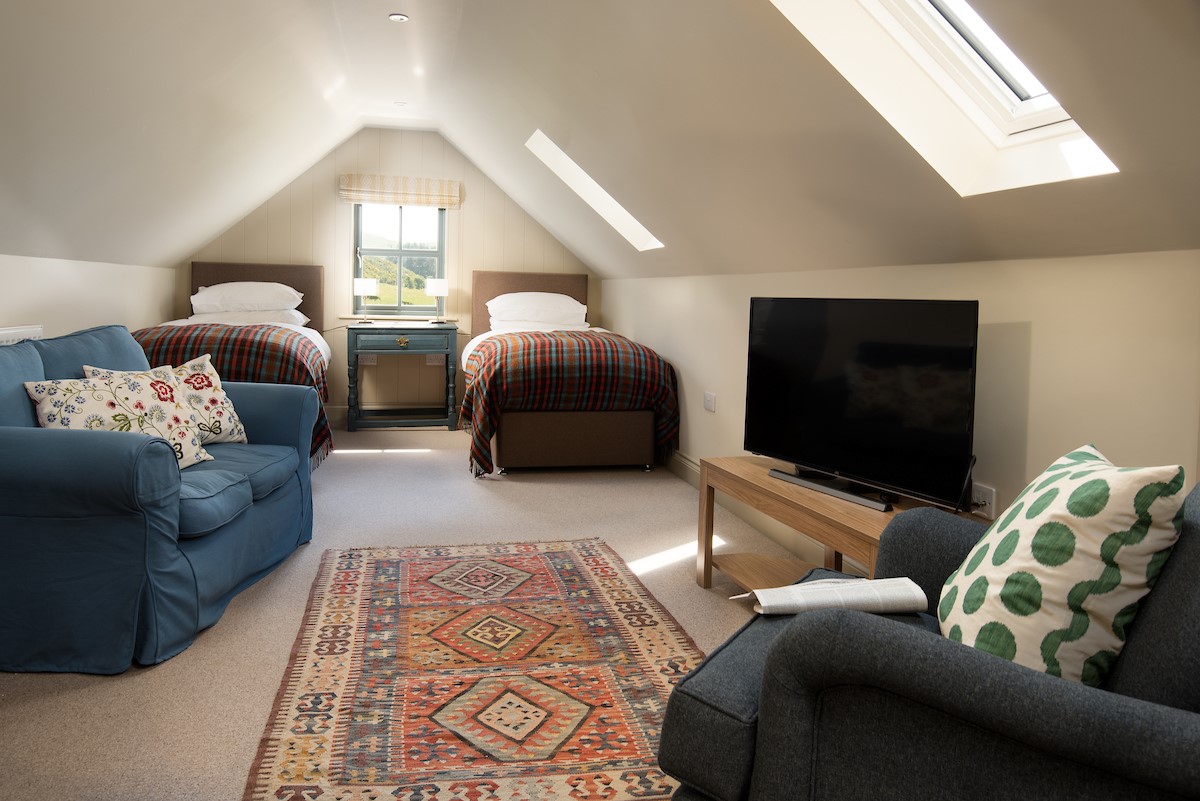 Housedon Haugh - bedroom six with twin beds and seating area