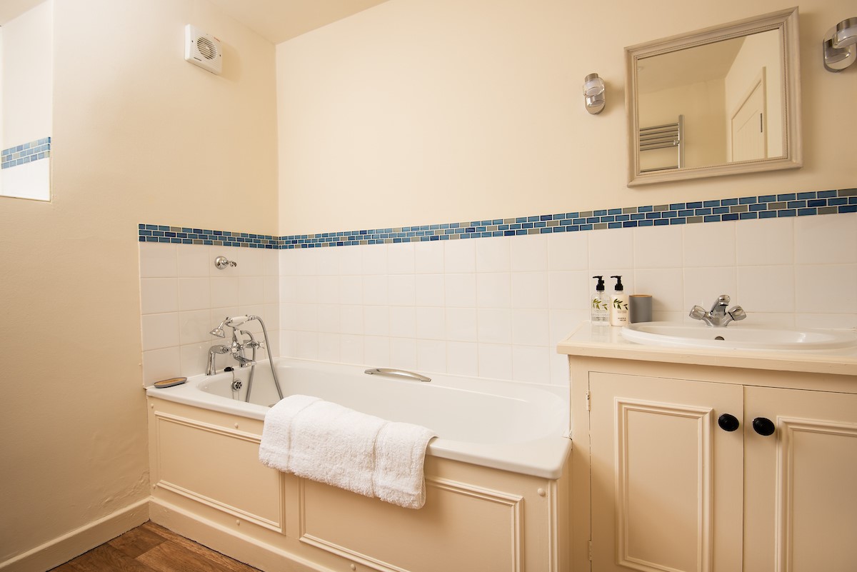 Grey Barns - bathroom three with bath and handheld shower