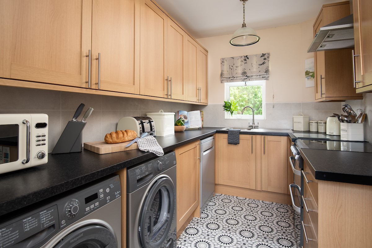 Kilham Cottage - small but well-equipped kitchen including washing machine and dryer