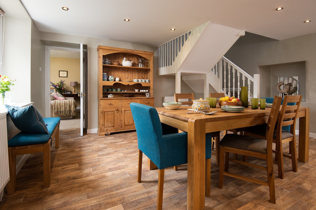 Pirnie Cottage - the dining area with staircase leading to the first floor