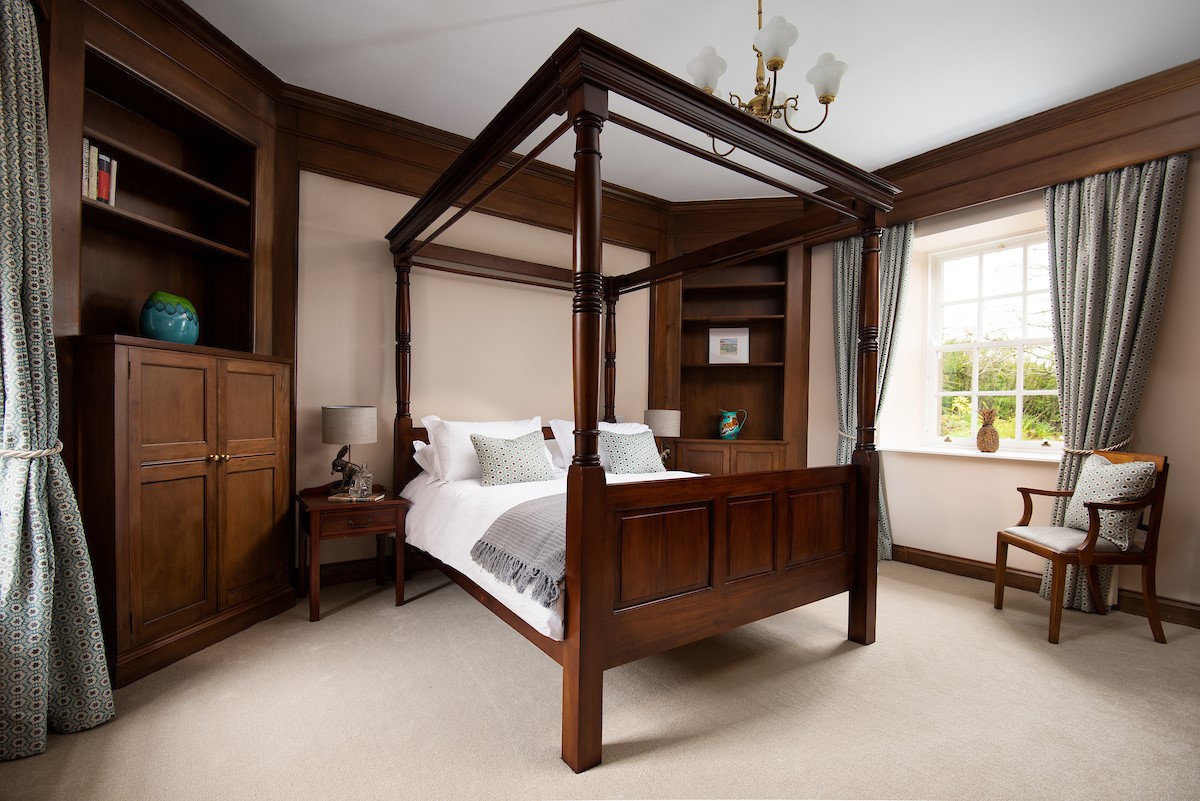 Fairnington East Wing - bedroom one with an impressive four poster bed