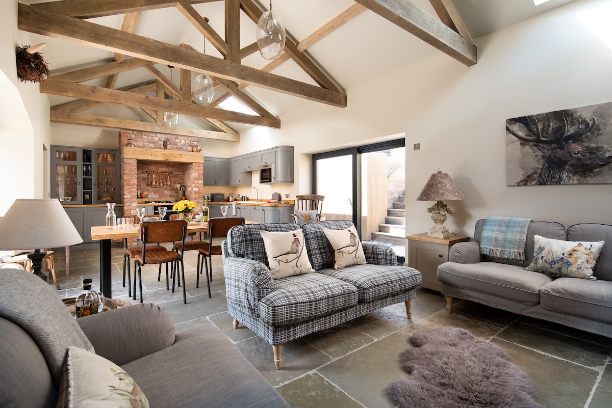 The Old Byre at West Moneylaws - open plan living with character touches of exposed beams and stonework
