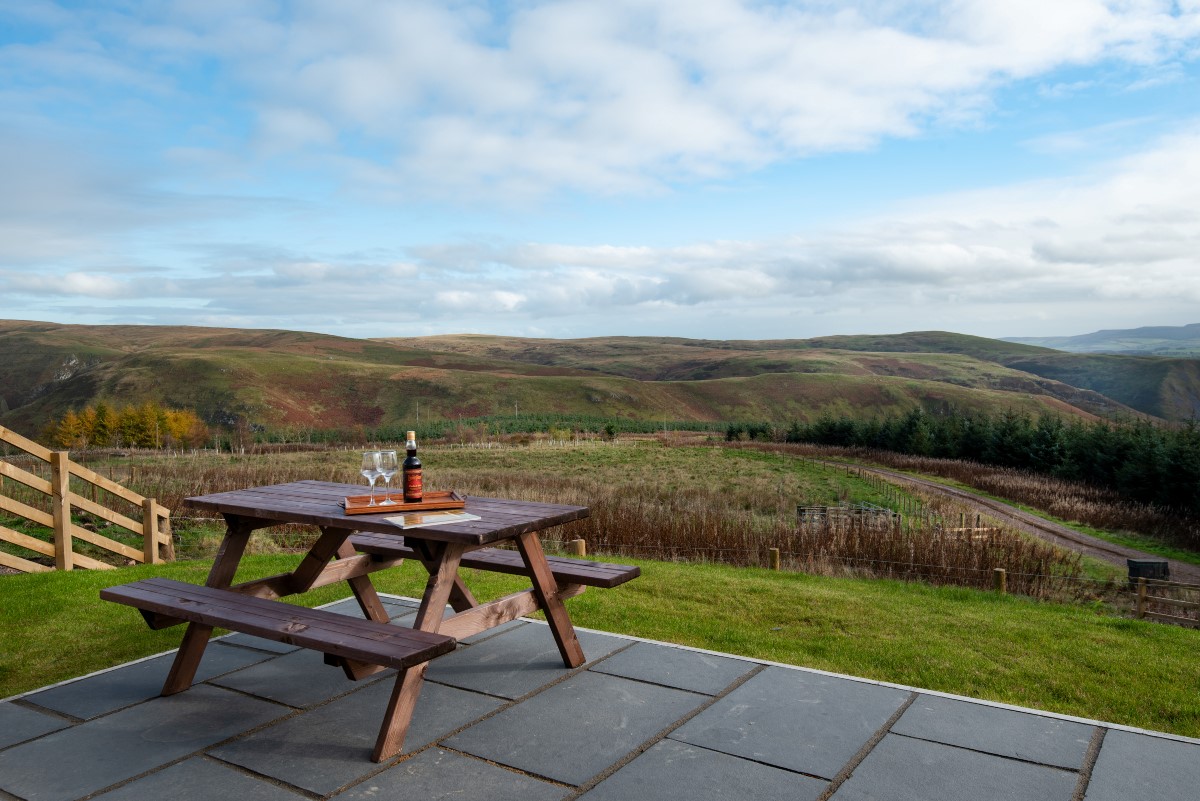 The Elm - take in the views across the Croquet valley whilst dining alfresco