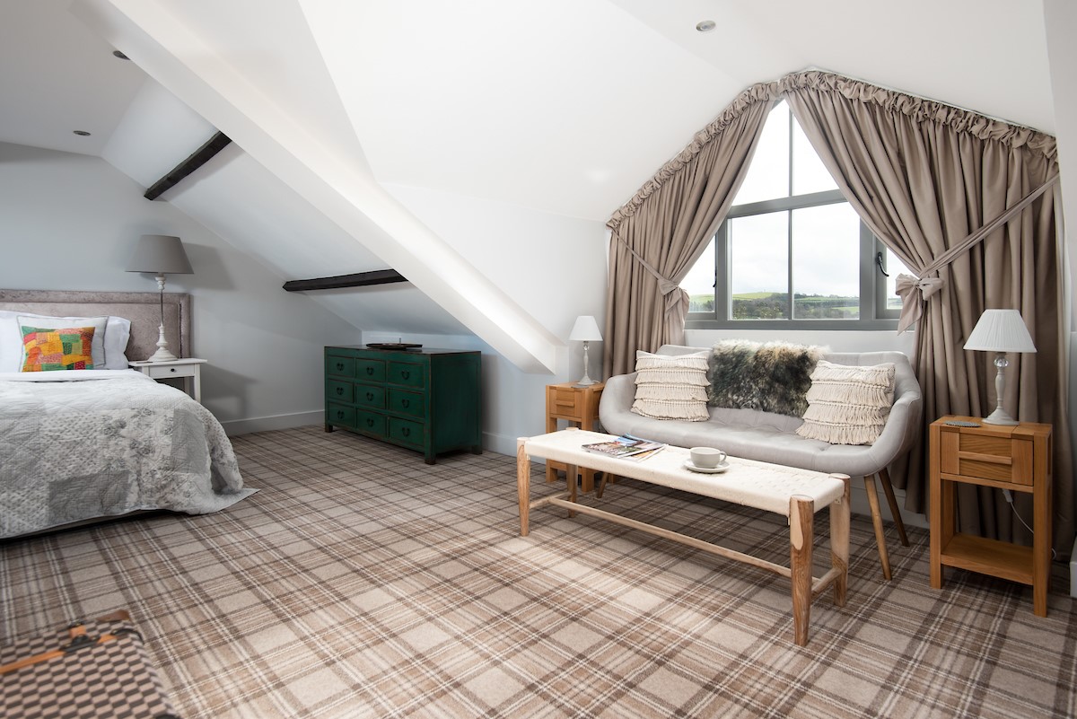 Number Nine, Lanchester - the mezzanine first floor bedroom with seating area and expansive picture window