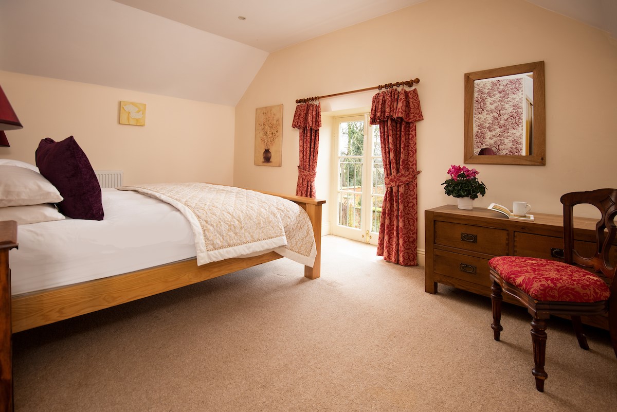 Dairy Cottage, Knapton Lodge - the spacious main bedroom with a charming Juliet balcony