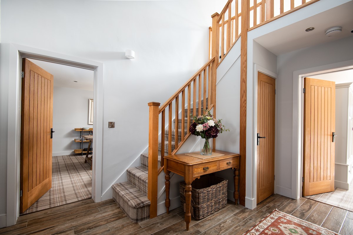 Number Nine, Lanchester - the double height entrance hallway with oak staircase to the first floor
