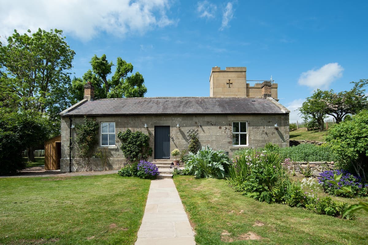 Poppy House - a period stone cottage with a contemporary conservatory and castellated tower