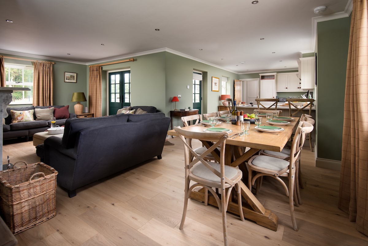 Risingham Cottage - open-plan sitting room, kitchen and dining area