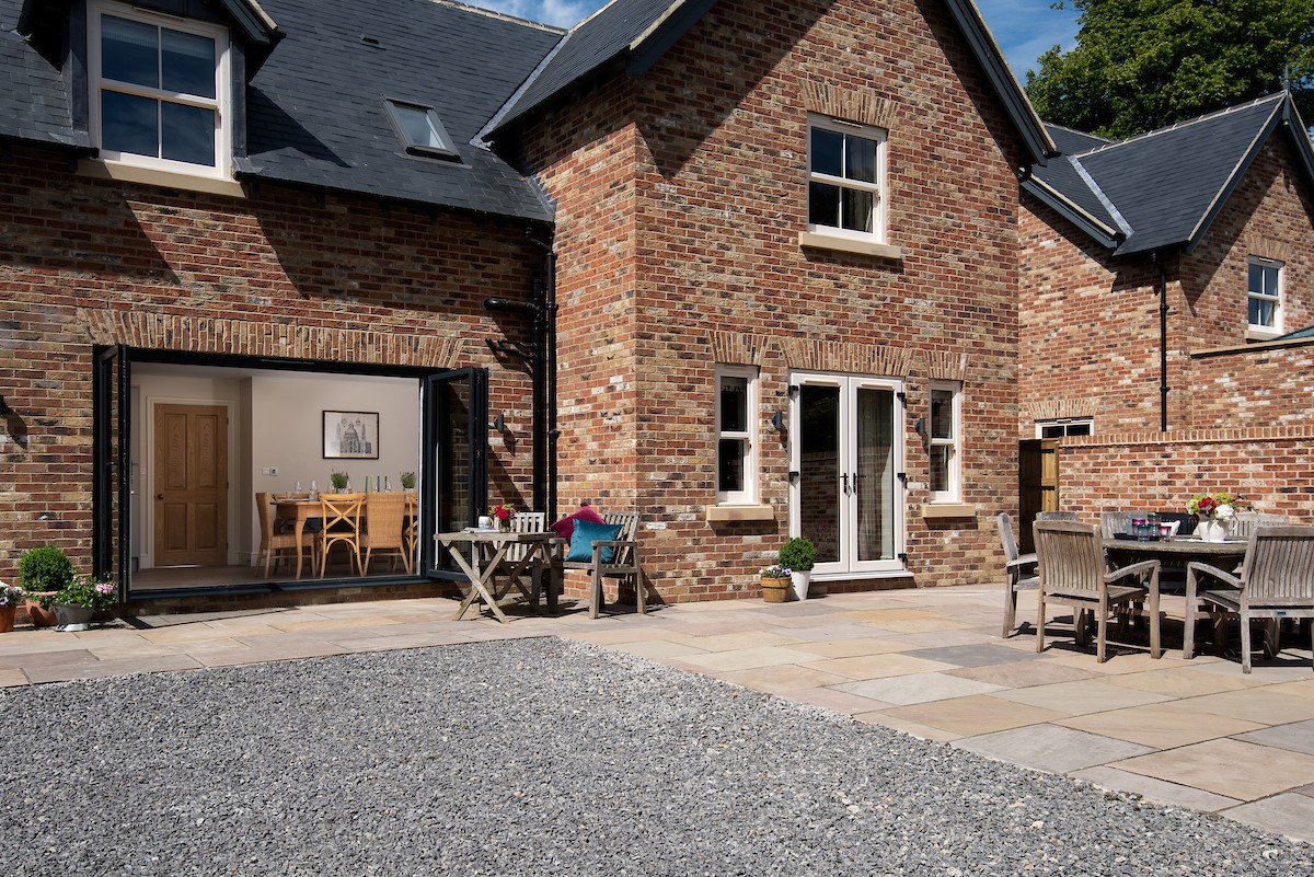 Partridge Lodge - the extensive terrace area; perfect for alfresco dining with a BBQ also provided