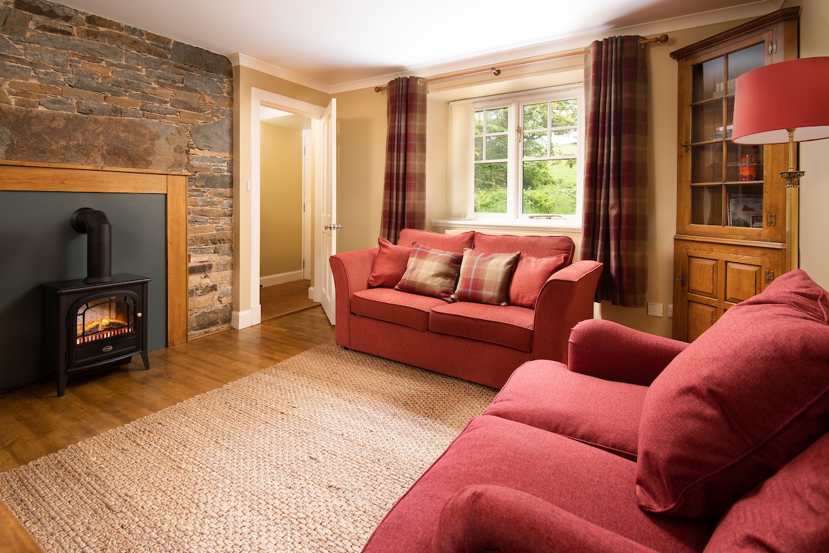 East Lodge at Ashiestiel - the well appointed lounge with an electric stove