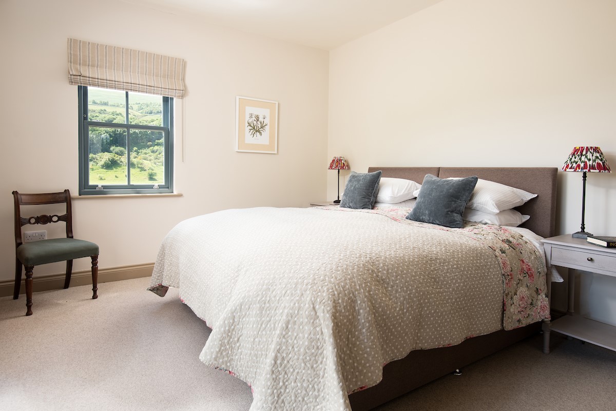 Housedon Haugh - bedroom two with a superking bed and double aspect views