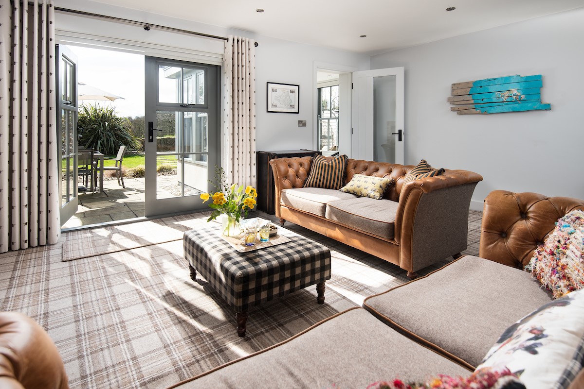 Number Nine, Lanchester - the comfortable and sunny lounge with direct garden access