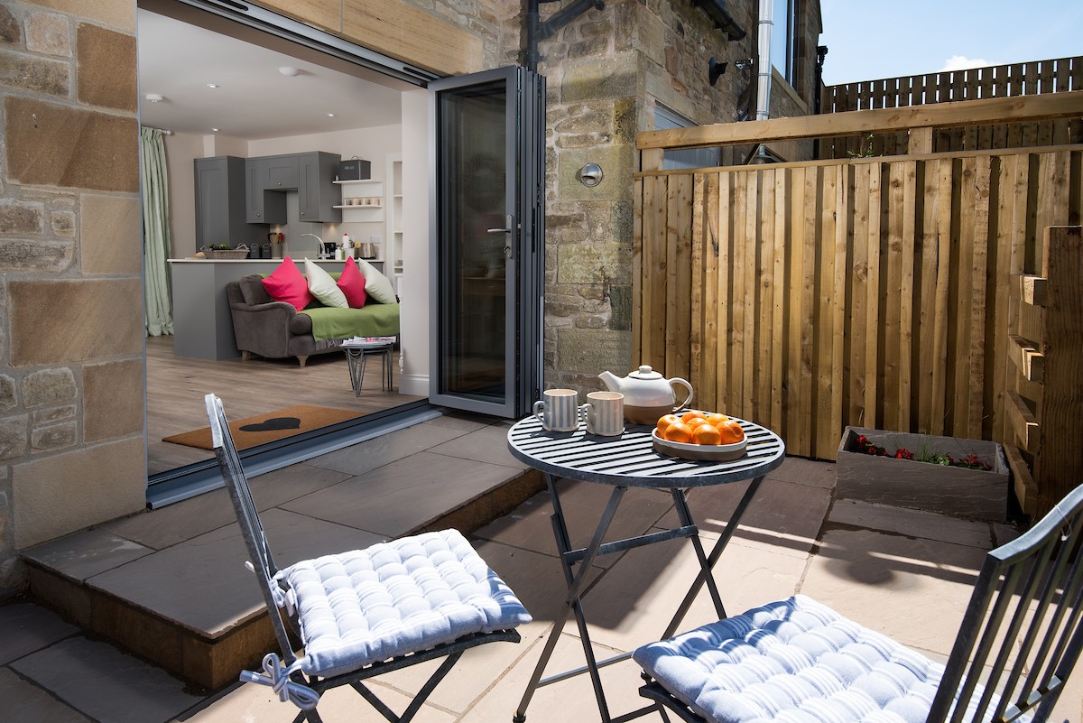 Romilly - the patio with seating for two