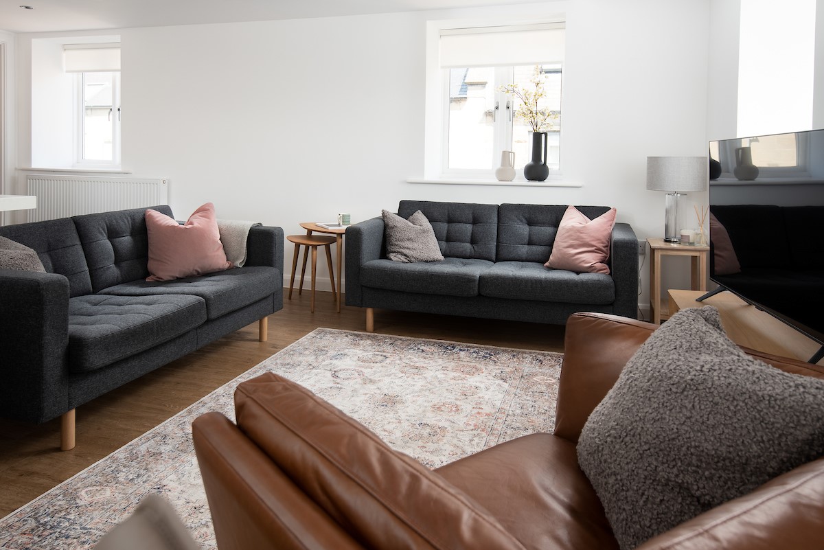 The Barley Loft - two comfortable sofas and an armchair in the sitting room