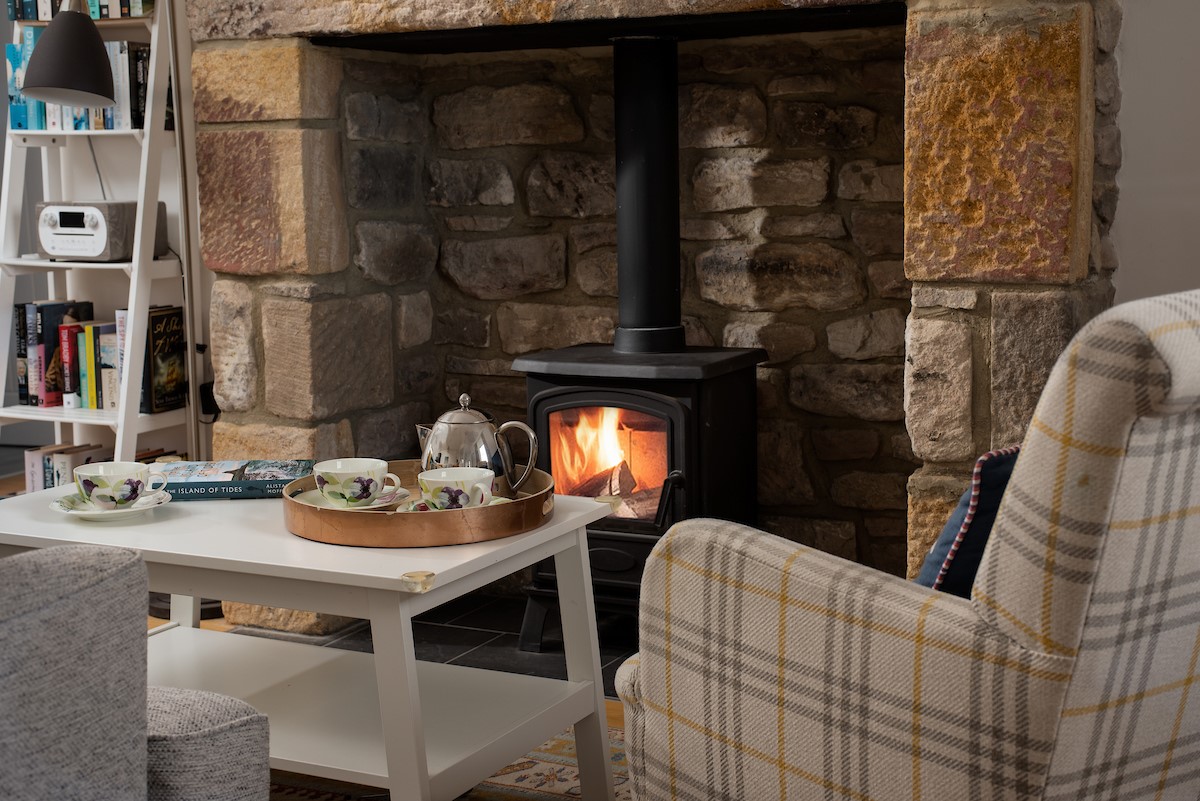 Peep-O-Sea Cottage - cosy up by the gas log burner set in the inglenook fireplace