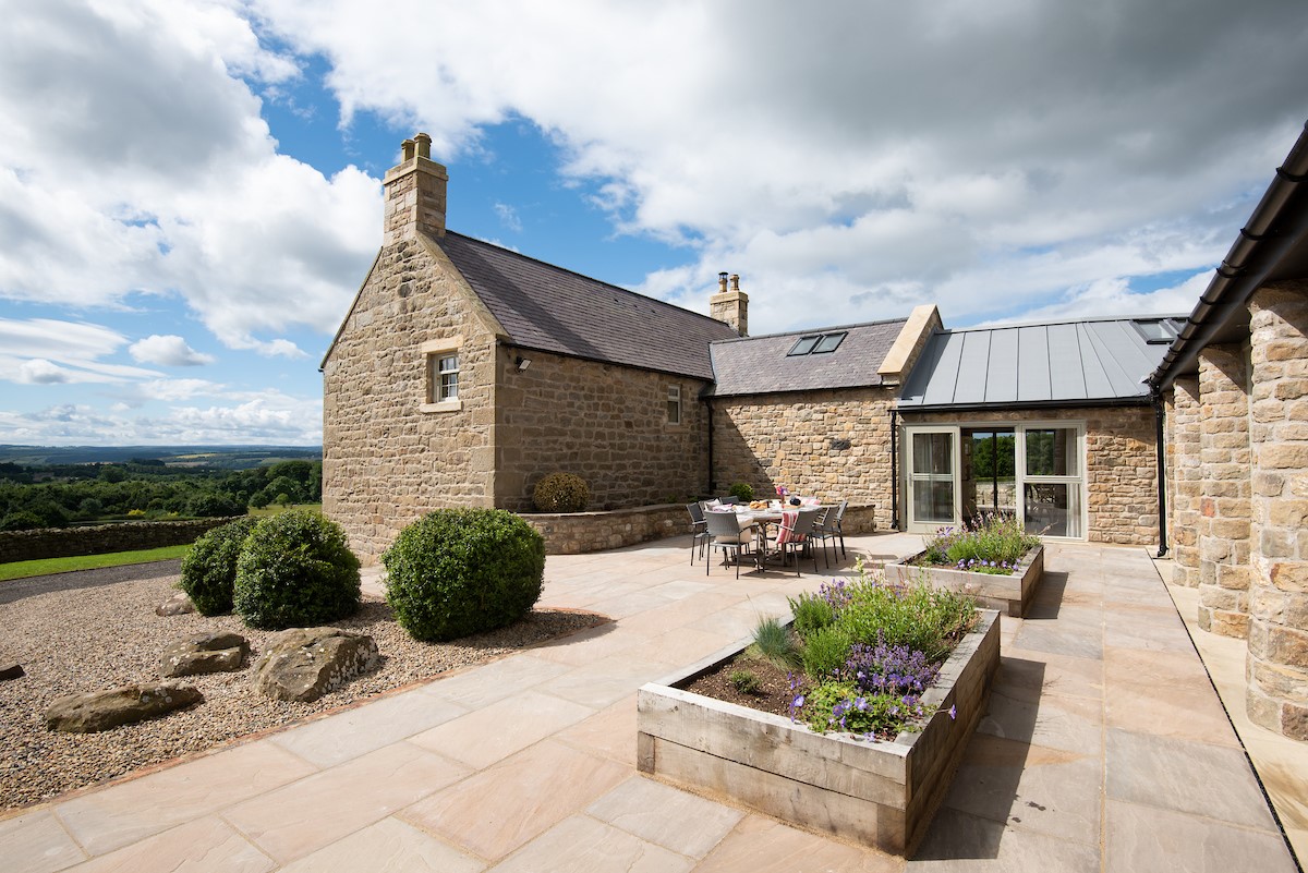 Shepherd's House - large patio to the rear with outdoor seating area and far reaching views