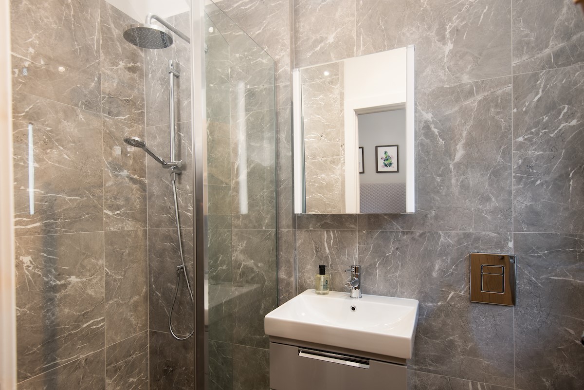 The Gallery - ground floor en-suite shower with containing shower with rainforest shower head and additional shower attachment