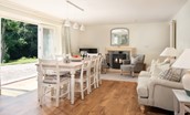 Open plan dining area with snug and large wood burner