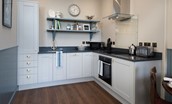 Glenburnie - kitchen with hob, oven, microwave, kettle and toaster