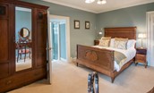 Abbey House - bedroom two with antique double bed and en suite bathroom