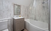 Crosslea - family bathroom on the first floor with bath and shower over, WC and basin