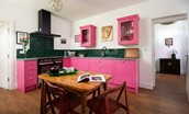 Walltown Farm Cottage - colourful kitchen with with cooker and 5-ring electric hob