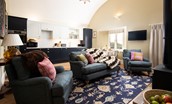 Lakeside Cottage - Alice - open-plan living space with a single-wall kitchen, dining area and comfortable seating around the log burner