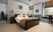 Eslington East Wing - bedroom two with 5' king size sleigh bed and matching bedside tables with lamps