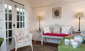 The Cottage - inside the summerhouse - ideal for afternoon tea!