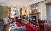 The Cottage - cosy sitting room with Harris Tweed and wood burner