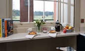 The Sculleries - kitchen breakfast bar with views over the parklands