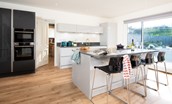 East Bay Beach House - kitchen breakfast bar with seating for four guests
